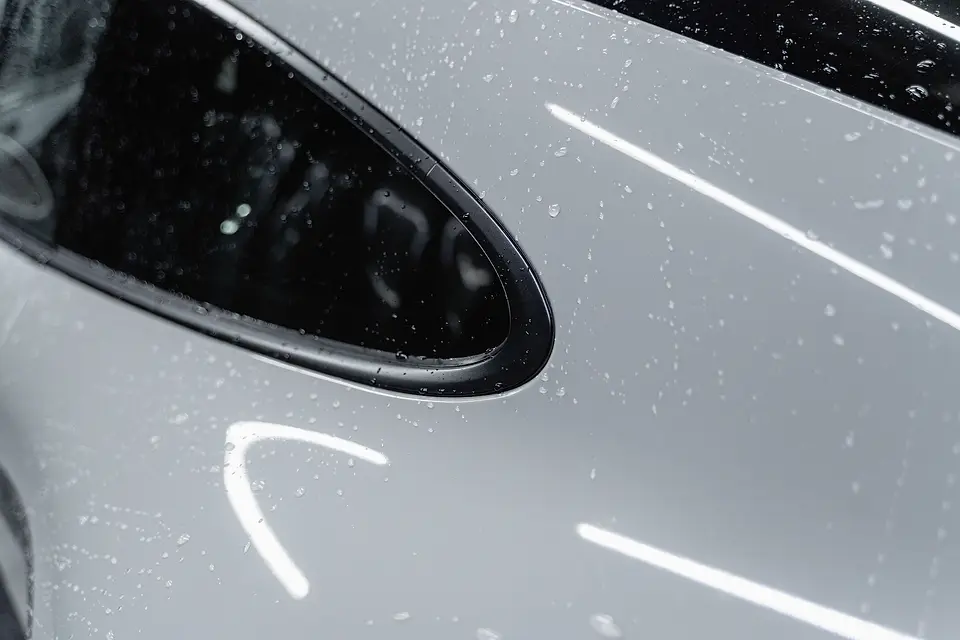 Water droplets on glossy white paint