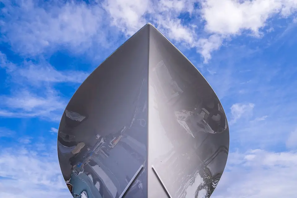 Shiny boat bow against a blue sky