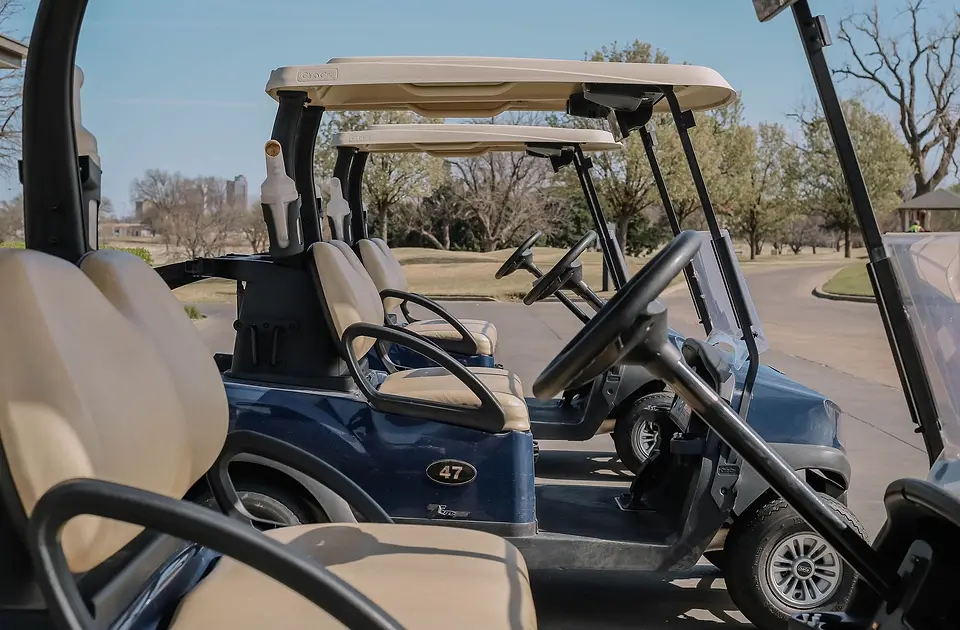 Blue golf cart on a sunny day