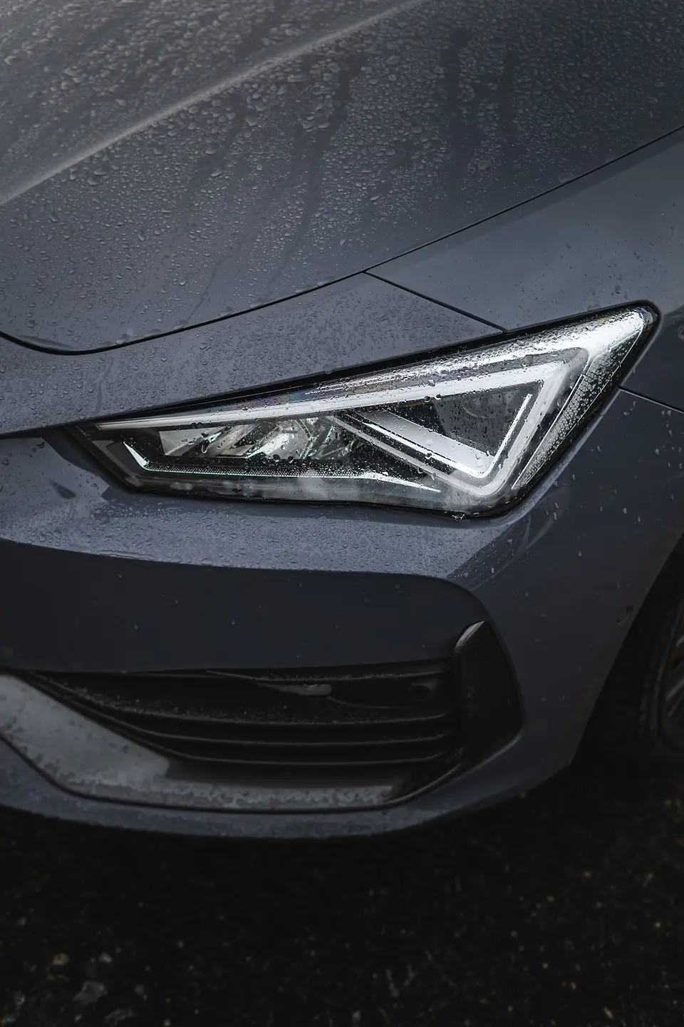 Clear modern headlight with water drops