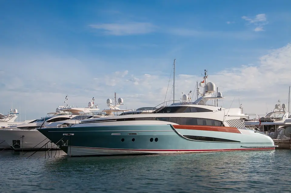 Glossy boats docked at a marina